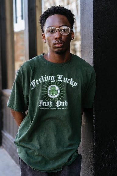 portrait of damon in glasses and green shirt